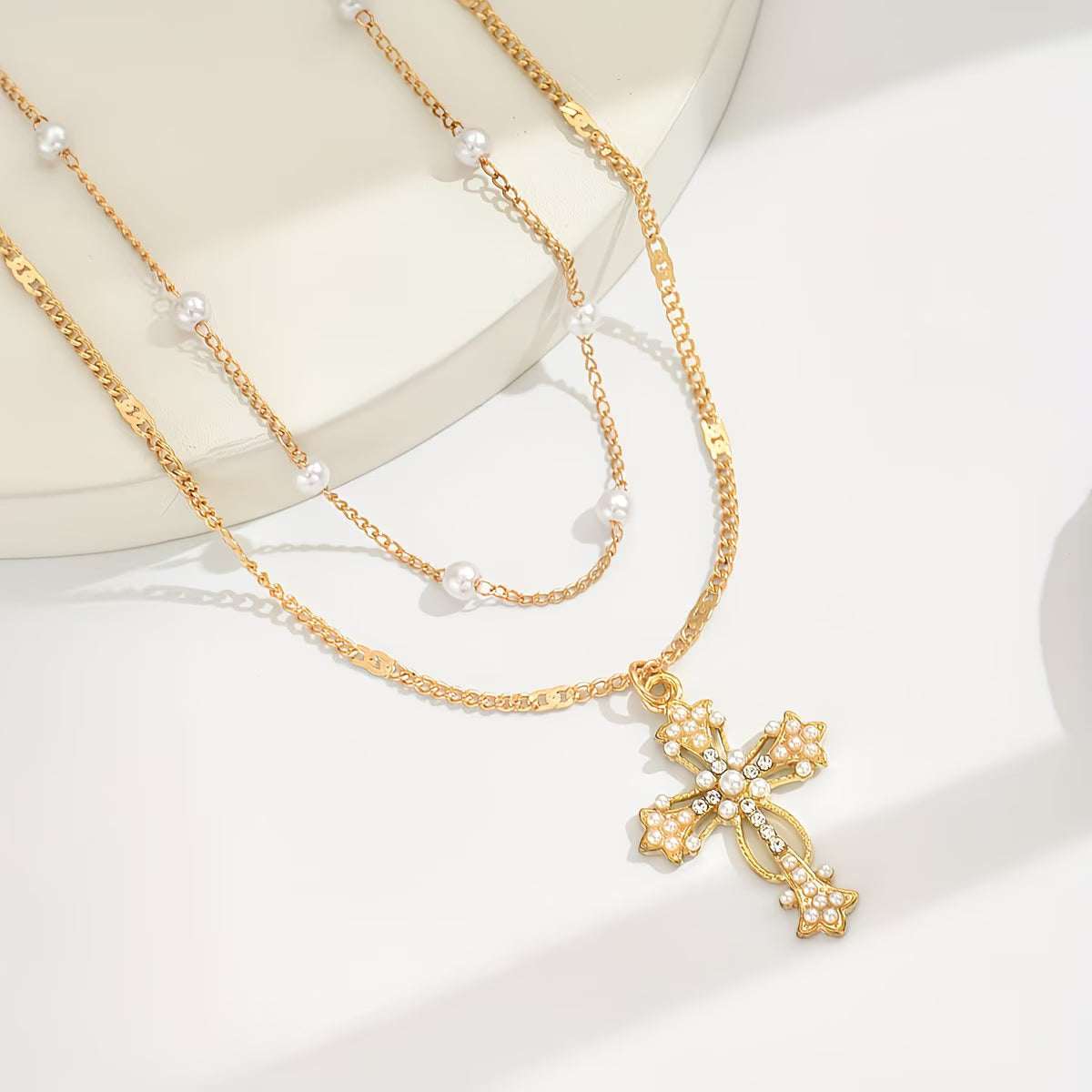 Collana con ciondolo croce multistrato