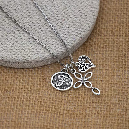 Collana cuore e croce con iniziale