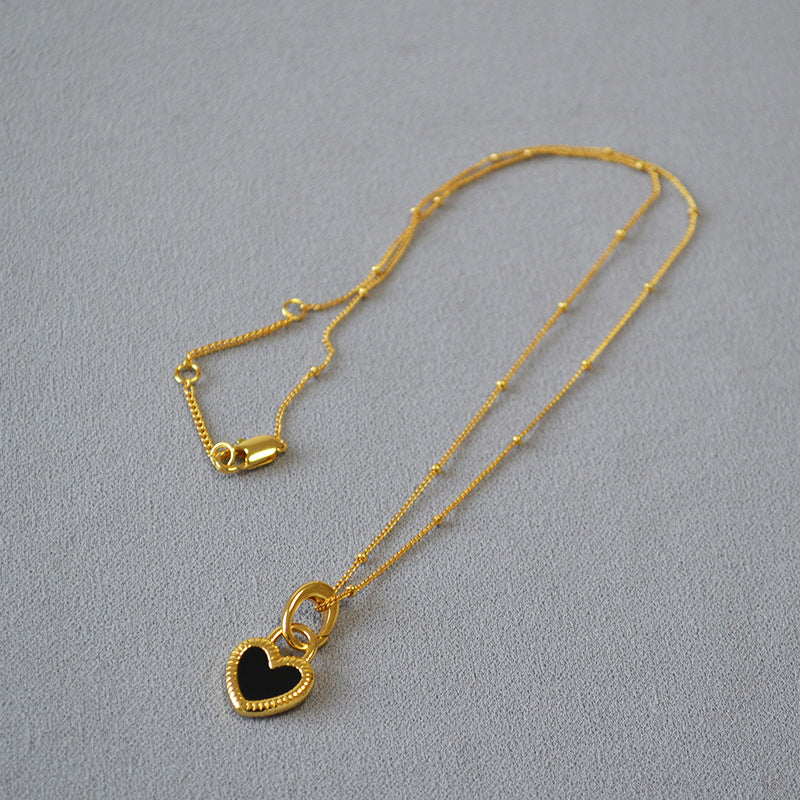Collana con Ciondolo Cuore Nero e Bianco in Oro