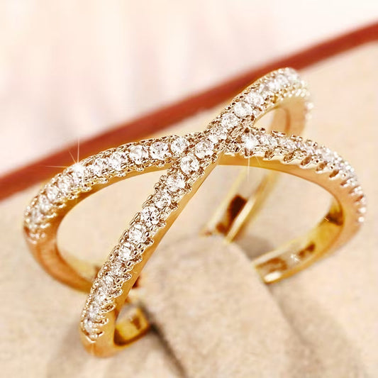 Anello croce con zircone intrecciato
