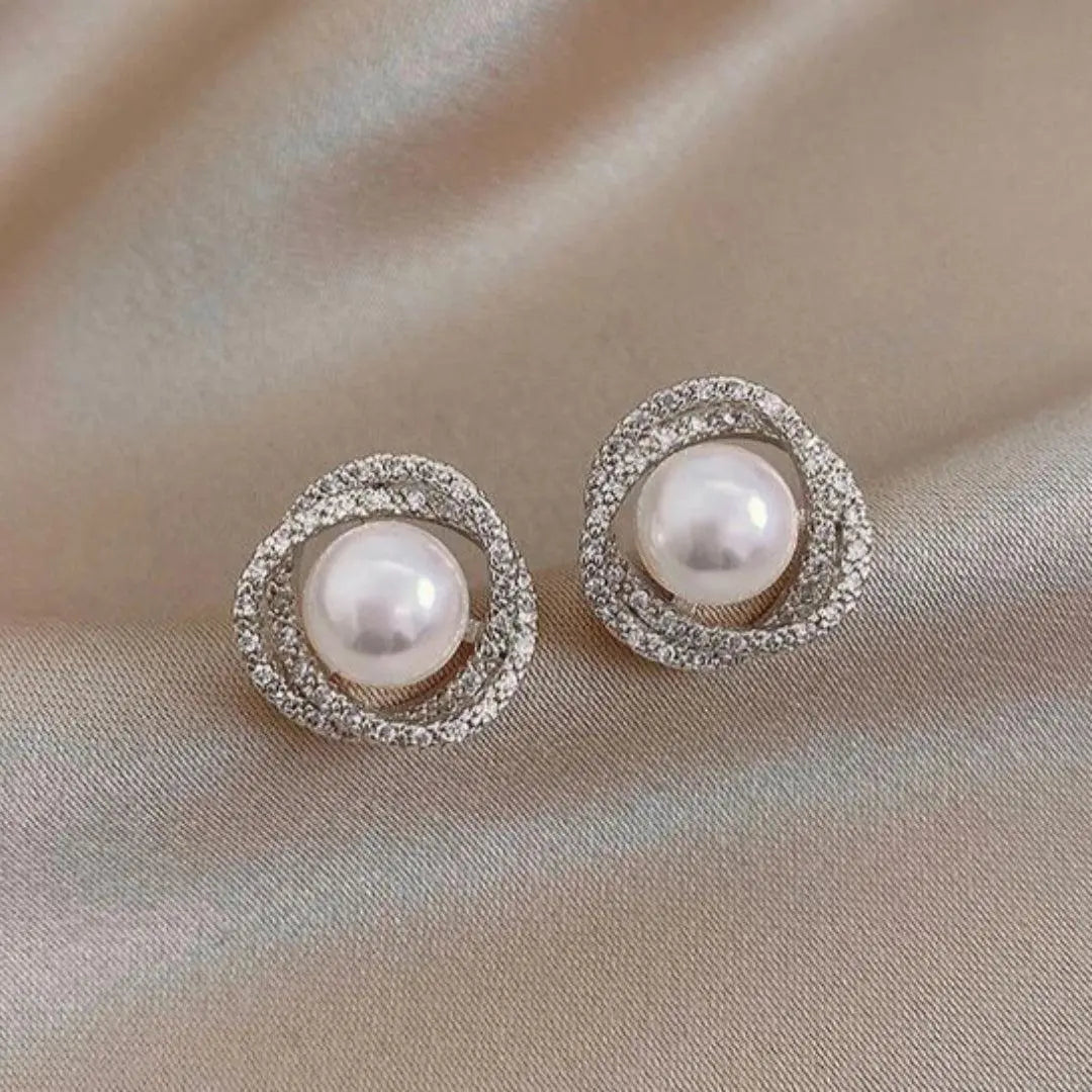 Orecchini a spirale brillanti con eleganti perle