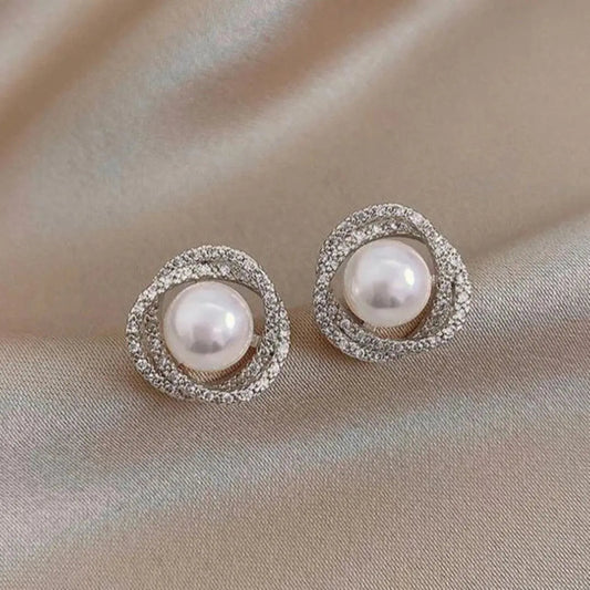 Orecchini a spirale brillanti con eleganti perle