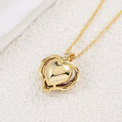 Collana cuore di rubino Angel Embrace | Oro