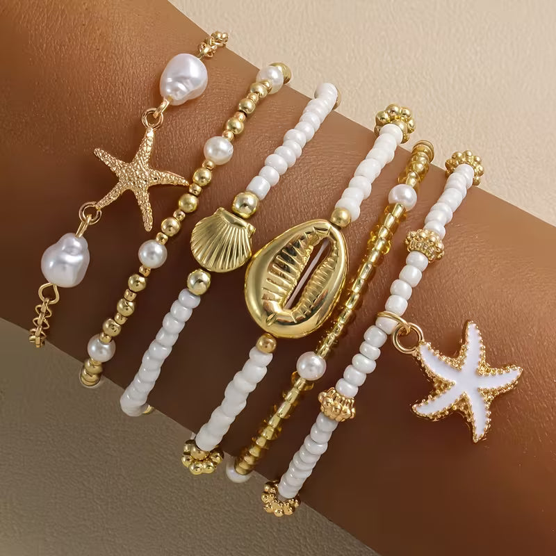 Set di 6 bracciali da spiaggia dorati
