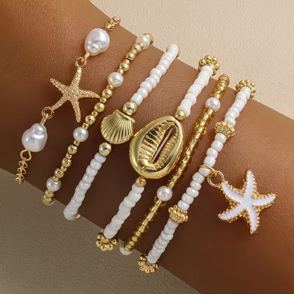 Set di 6 bracciali da spiaggia dorati