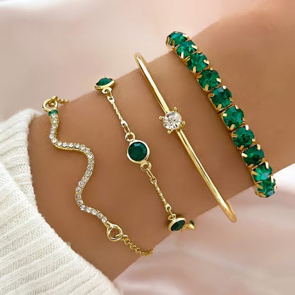 Set di bracciali dorati con gemme