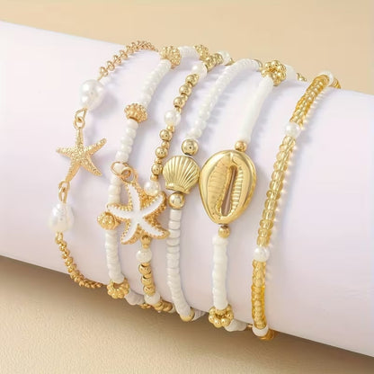 Set di 6 bracciali da spiaggia dorati