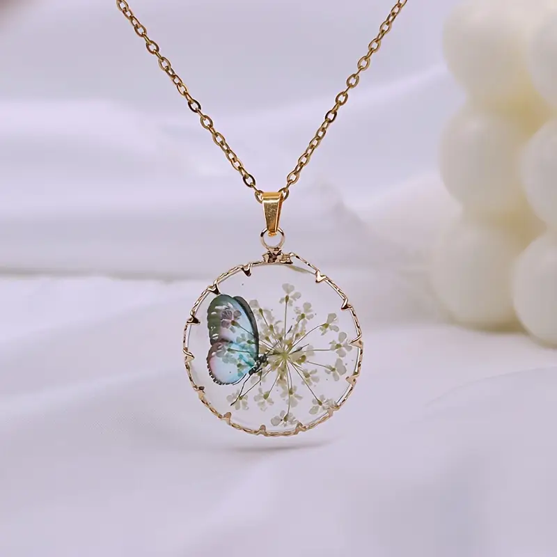 Collana oro floreale con farfalla