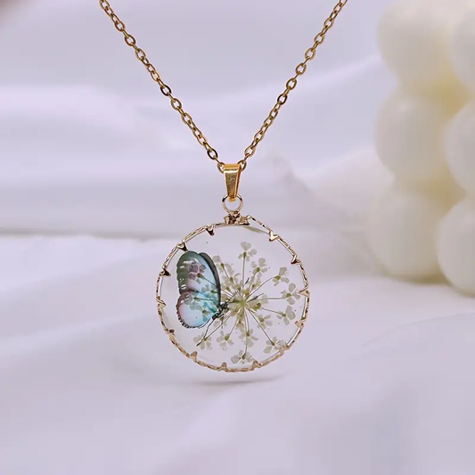 Collana oro floreale con farfalla